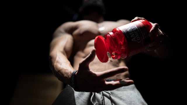 Muscular arm lifting weight